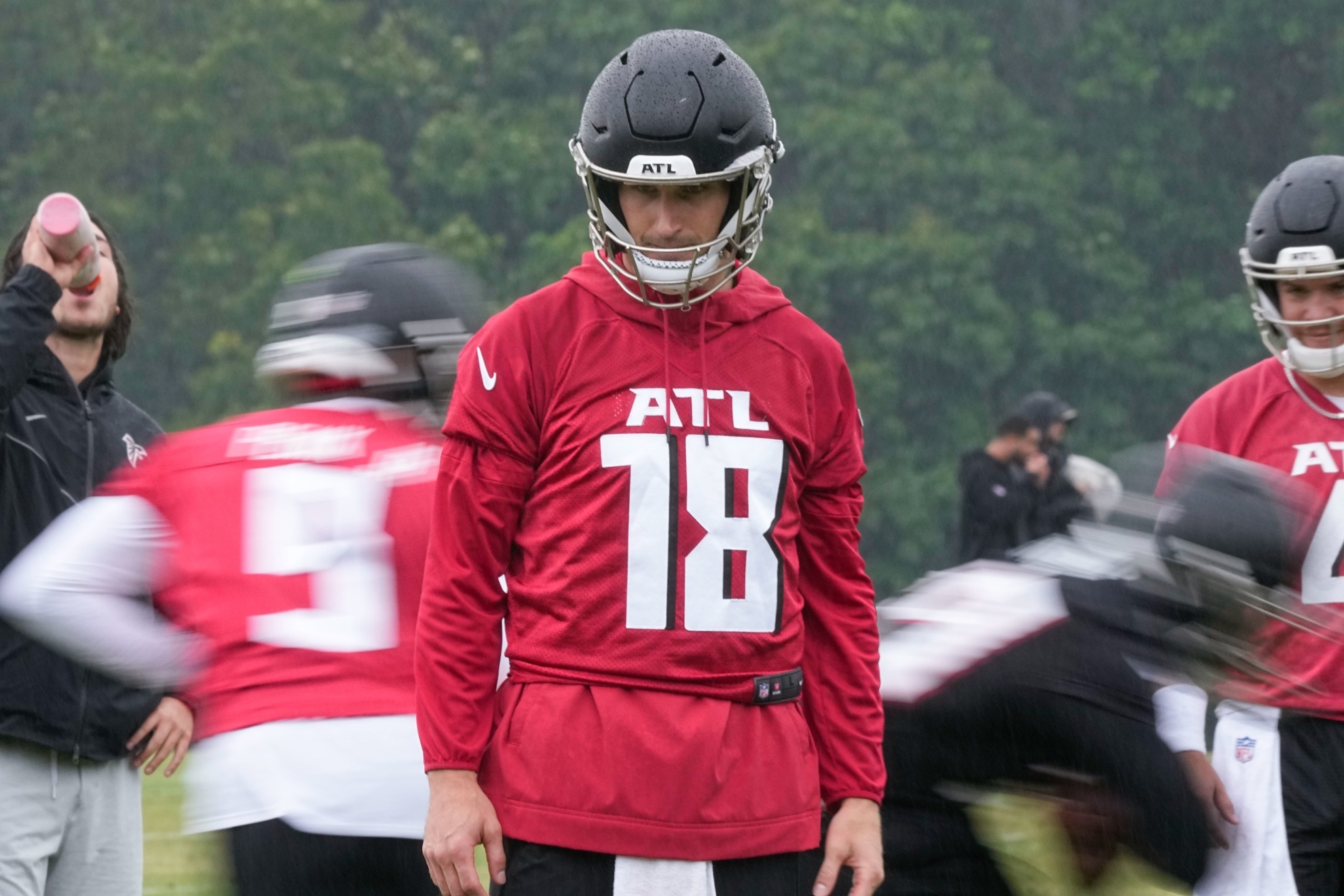 Atlanta Falcons quarterback Kirk Cousins runs drills during an NFL football mini training camp practice on Tuesday, May 14, 2024, in Flowery Branch, Ga. (AP Photo/Brynn Anderson)