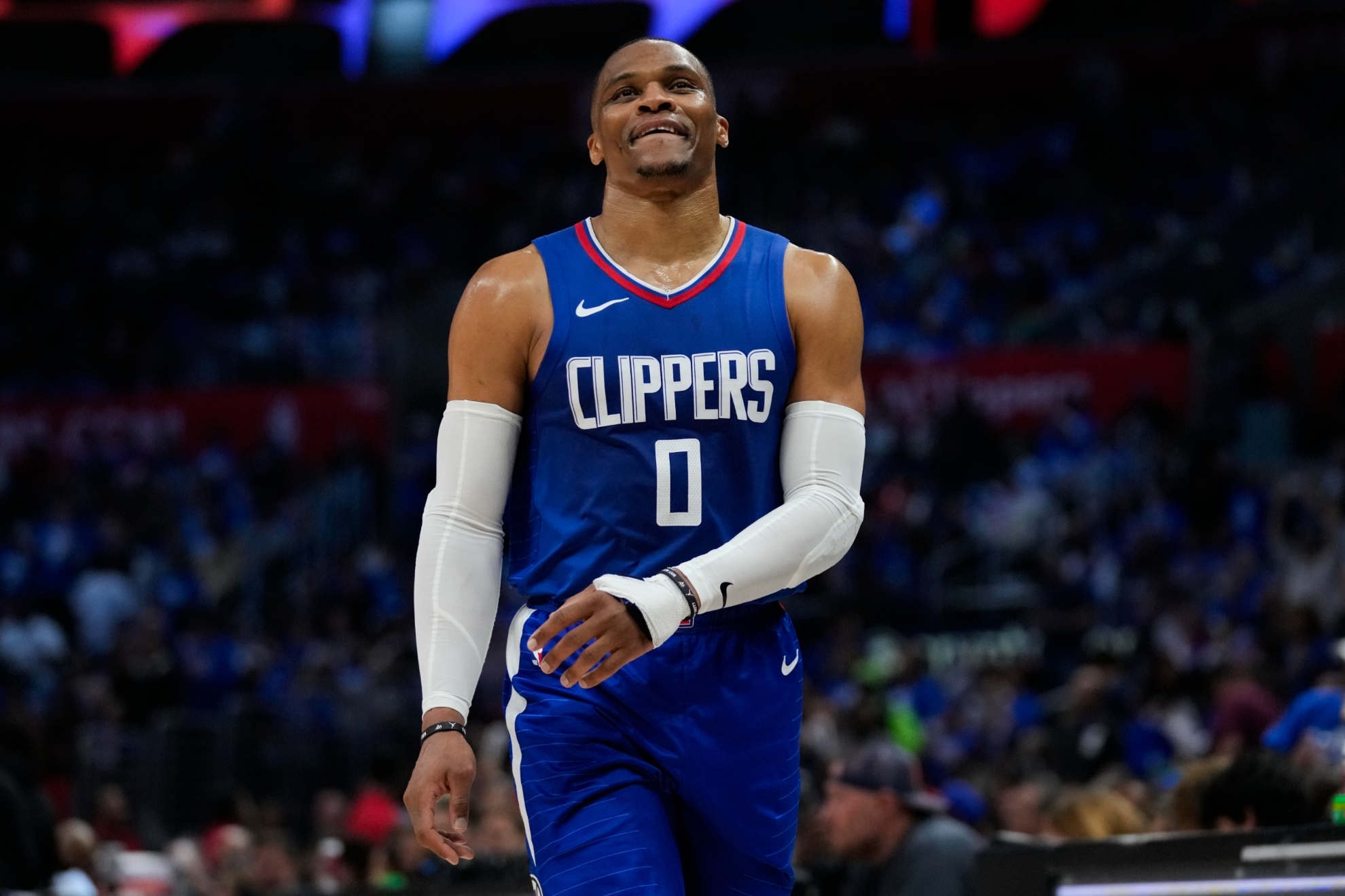 LA Clippers guard Russell Westbrook (0) walks down the court during a timeout during the second half of Game 1 of an NBA basketball first-round playoff series against the Dallas Mavericks in Los Angeles, Sunday, April 21, 2024. (AP Photo/Ashley Landis)