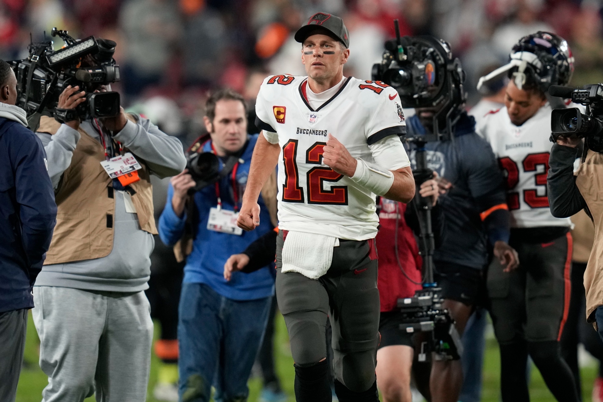 Tampa Bay Buccaneers quarterback Tom Brady (12) leaves the field after an NFL wild-card football game against the Dallas Cowboys, Monday, Jan. 16, 2023, in Tampa, Fla. The Dallas Cowboys won 31-14. (AP Photo/John Raoux)