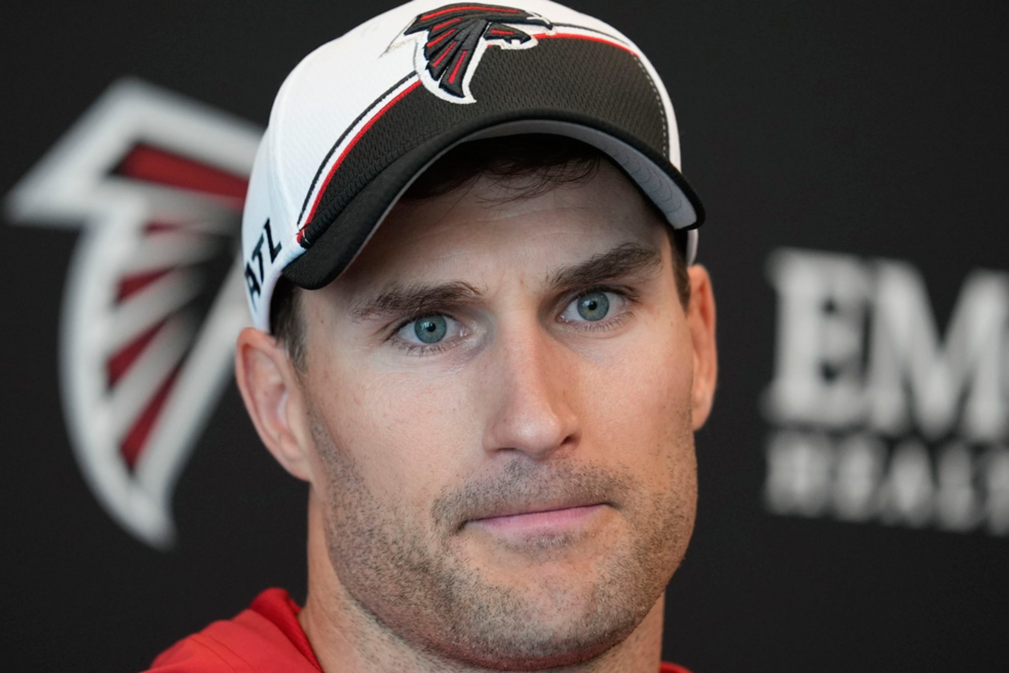 Kirk Cousins speaks during a news conference after an NFL football practice /