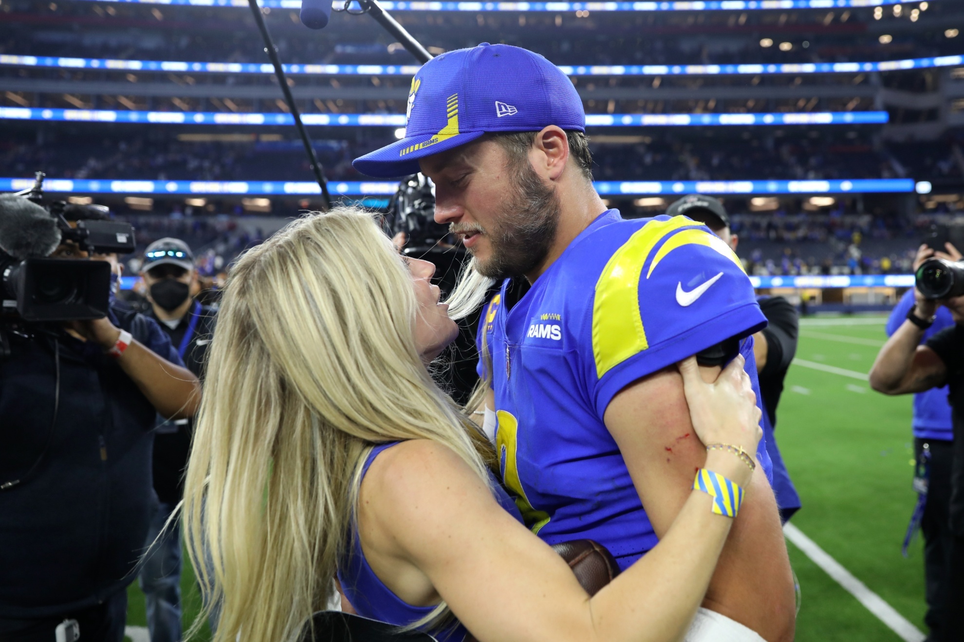 Los Angeles Rams Matthew Stafford celebrates with wife Kelly Hall after the NFC Championship NFL football game against the San Francisco 49ers Sunday, Jan. 30, 2022, in Inglewood, Calif. The Rams won 20-17 to advance to the Super Bowl. (AP Photo/Jed Jacobsohn)