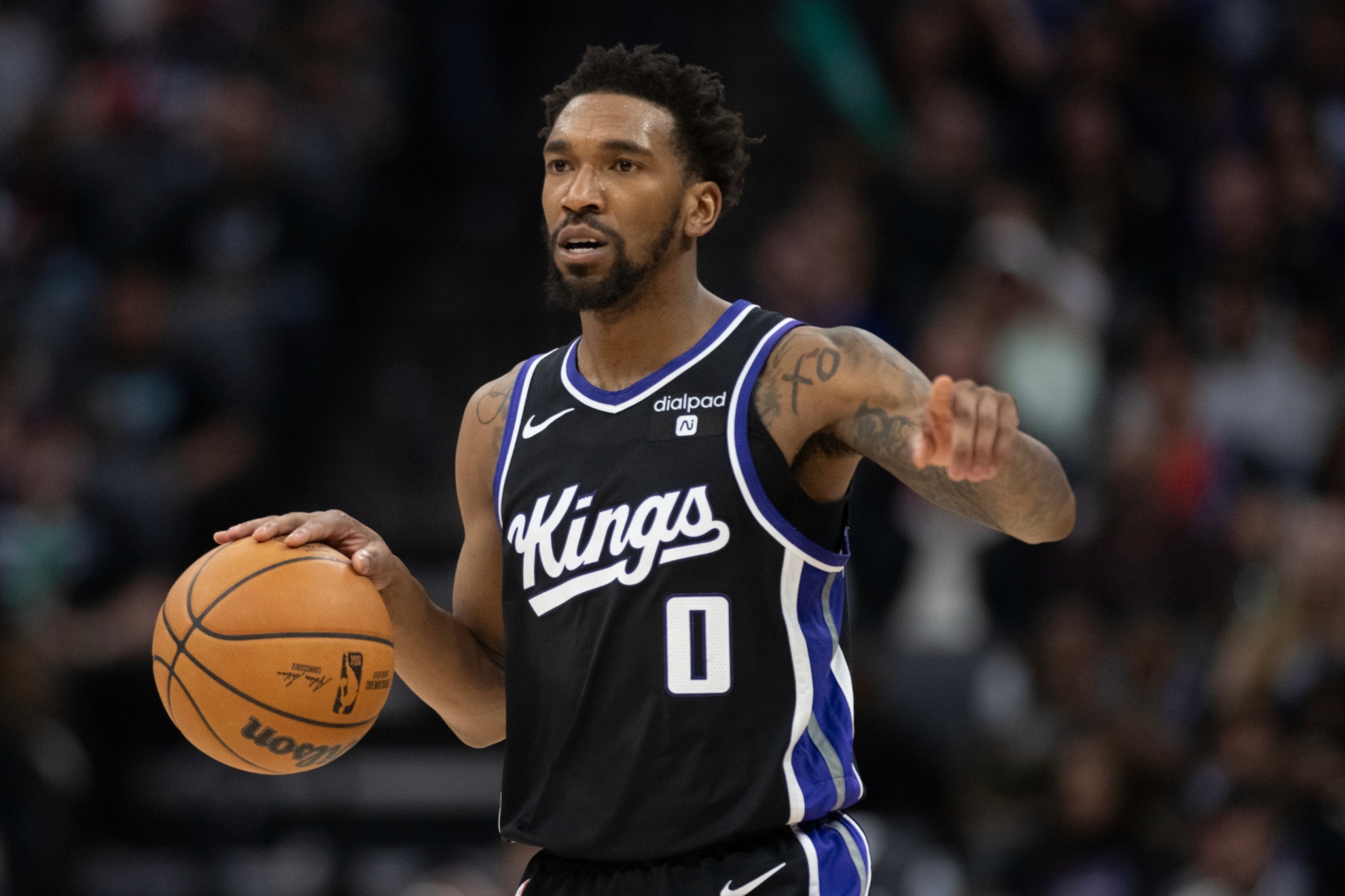 Sacramento Kings guard Malik Monk (0) brings the ball up court in the second half of an NBA basketball game against the Philadelphia 76ers in Sacramento, Calif., Monday, March 25, 2024. The Kings won 108-96. (AP Photo/Jos� Luis Villegas)