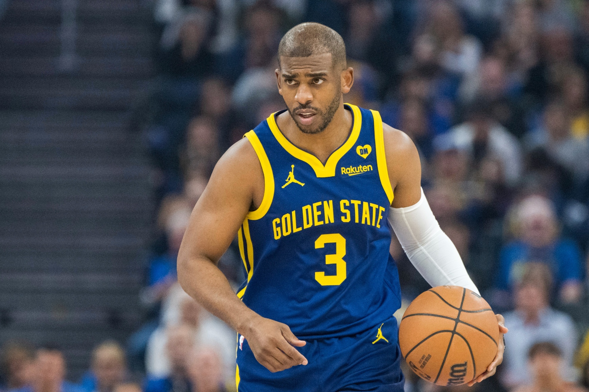 Golden State Warriors guard Chris Paul dribbles during the first half of an NBA basketball game against the Utah Jazz, Sunday, April 7, 2024, in San Francisco. (AP Photo/Nic Coury)