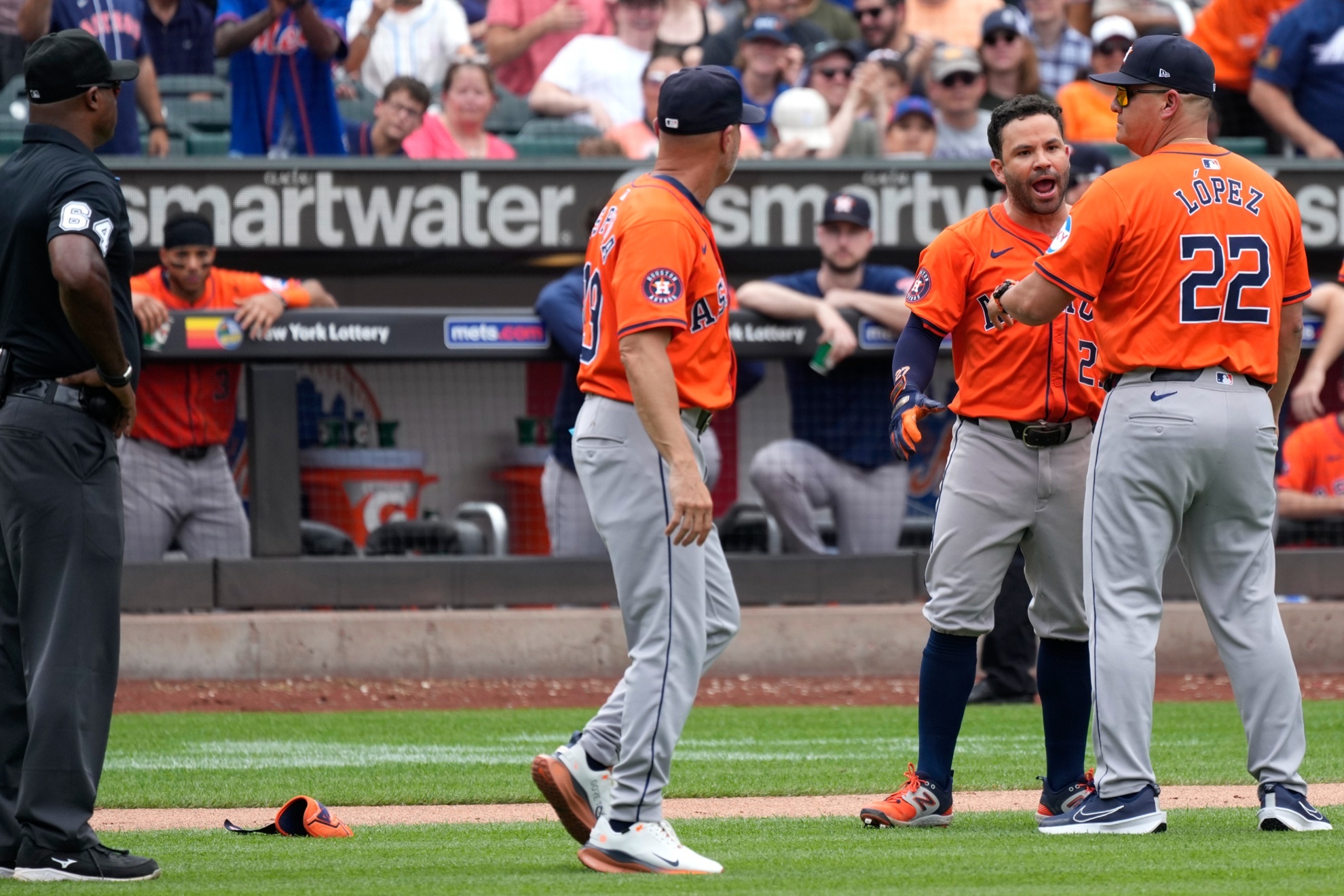 Houston Astros Jose Altuve, second from right, argues on the field before being ejected by umpire James Jean during the seventh inning of a baseball game against the New York Mets, Sunday, June 30, 2024, in New York. (AP Photo/Pamela Smith)