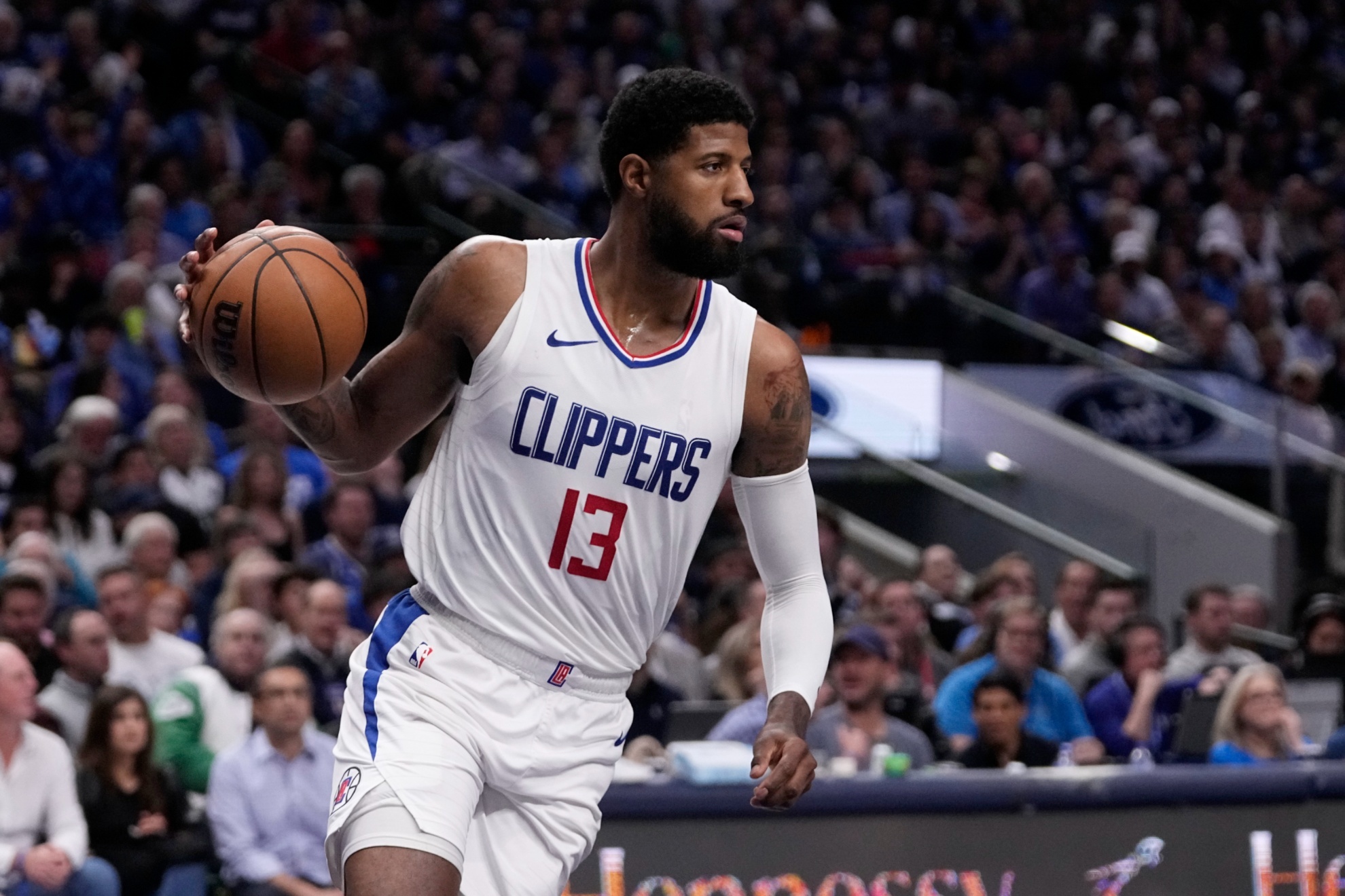 Los Angeles Clippers Paul George works against the Dallas Mavericks in Game 2 of an NBA basketball first-round playoff series in Dallas, Friday, April 26, 2024. (AP Photo/Tony Gutierrez)