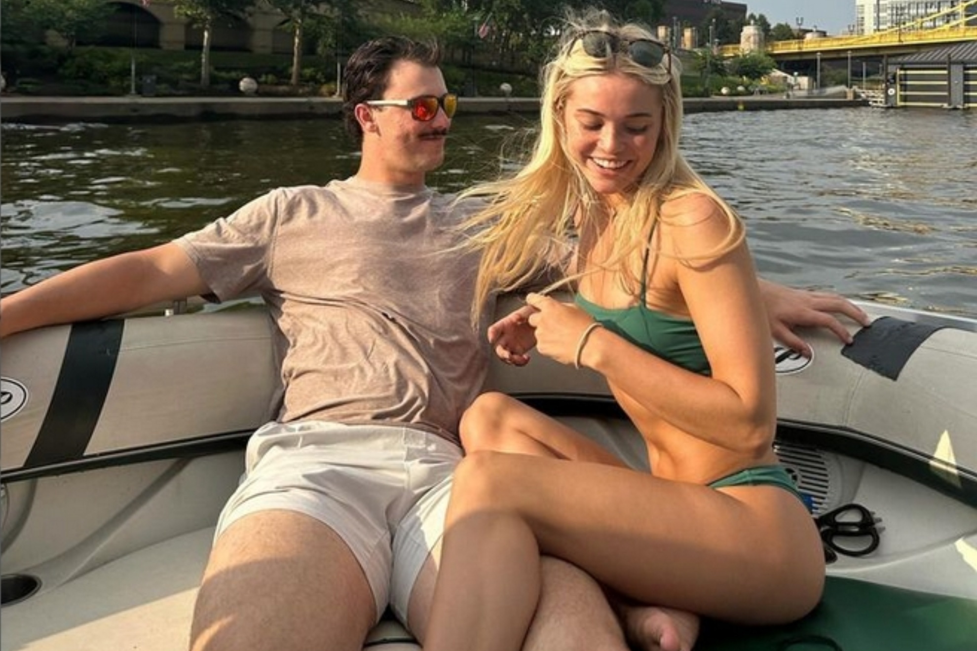 Paul Skennes and Olivia Dunne enjoy a boat ride with their friends in Pittsburgh.