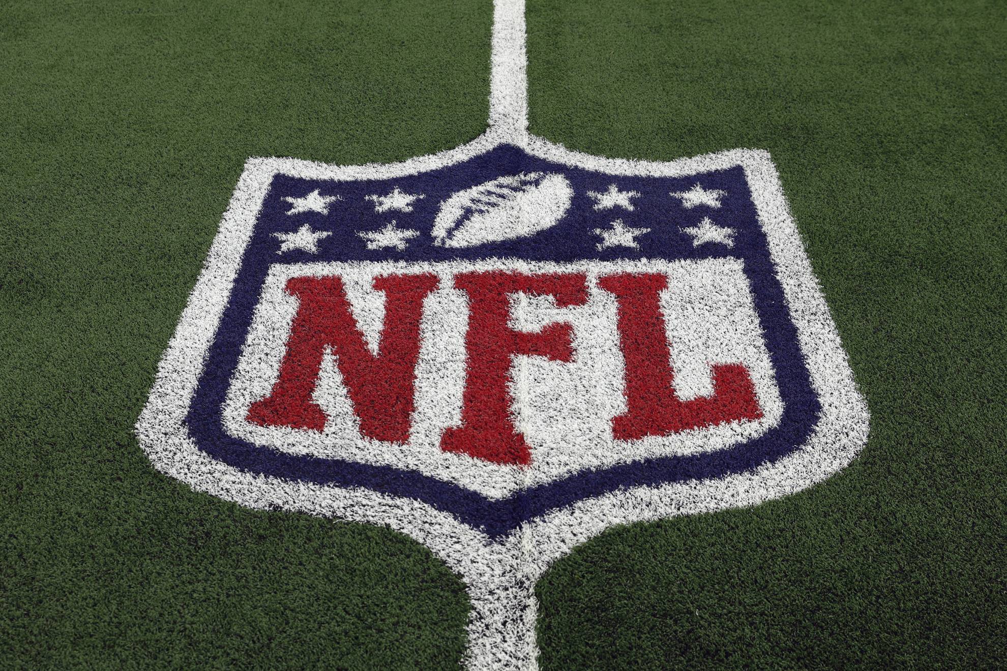 The NFL logo is shown on the field before an NFL football game between the Detroit Lions and the Dallas Cowboys, Saturday, Dec. 30, 2023, in Arlington, Texas.