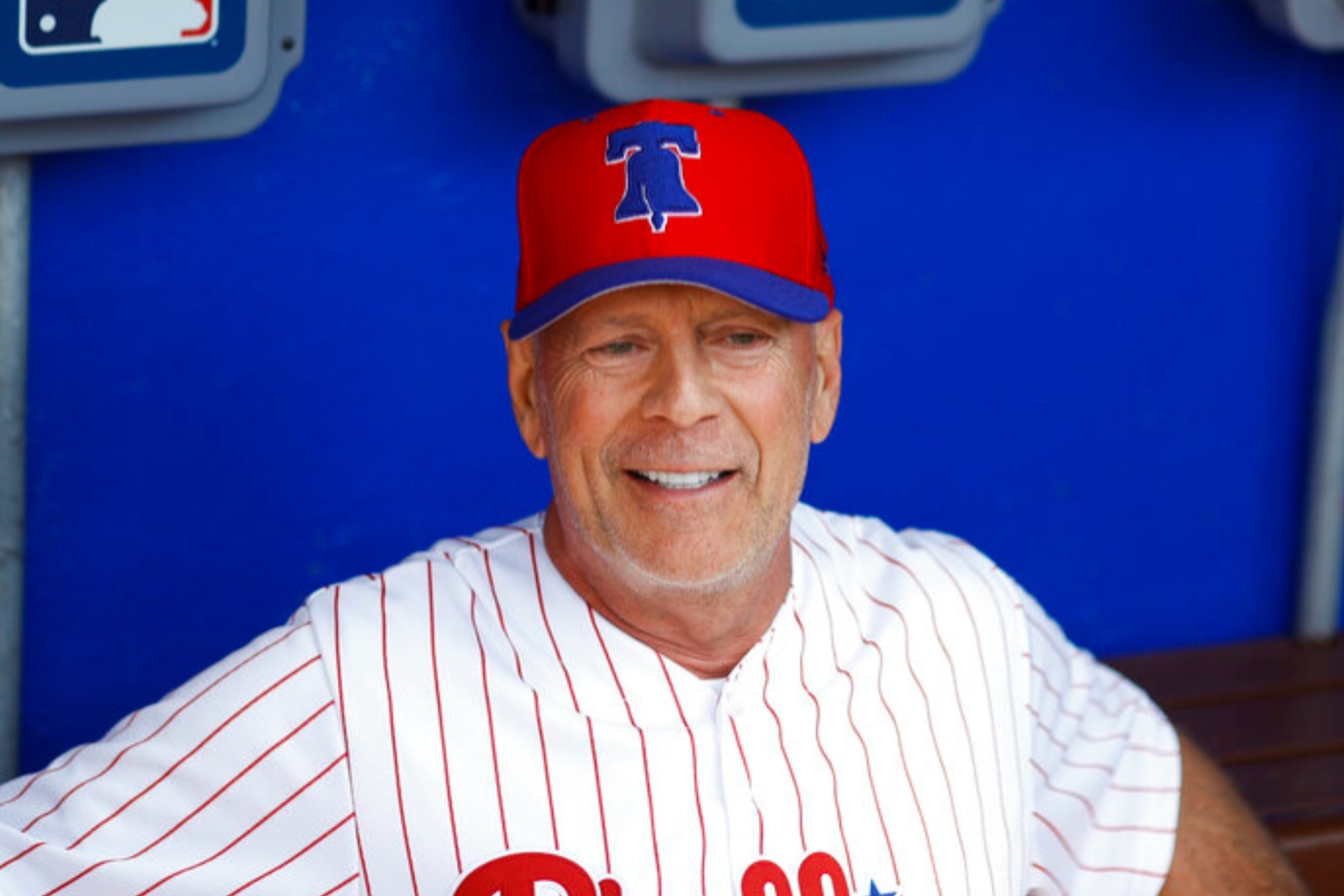 Bruce Willis smiles before a Philadelphia Phillies baseball game in 2019