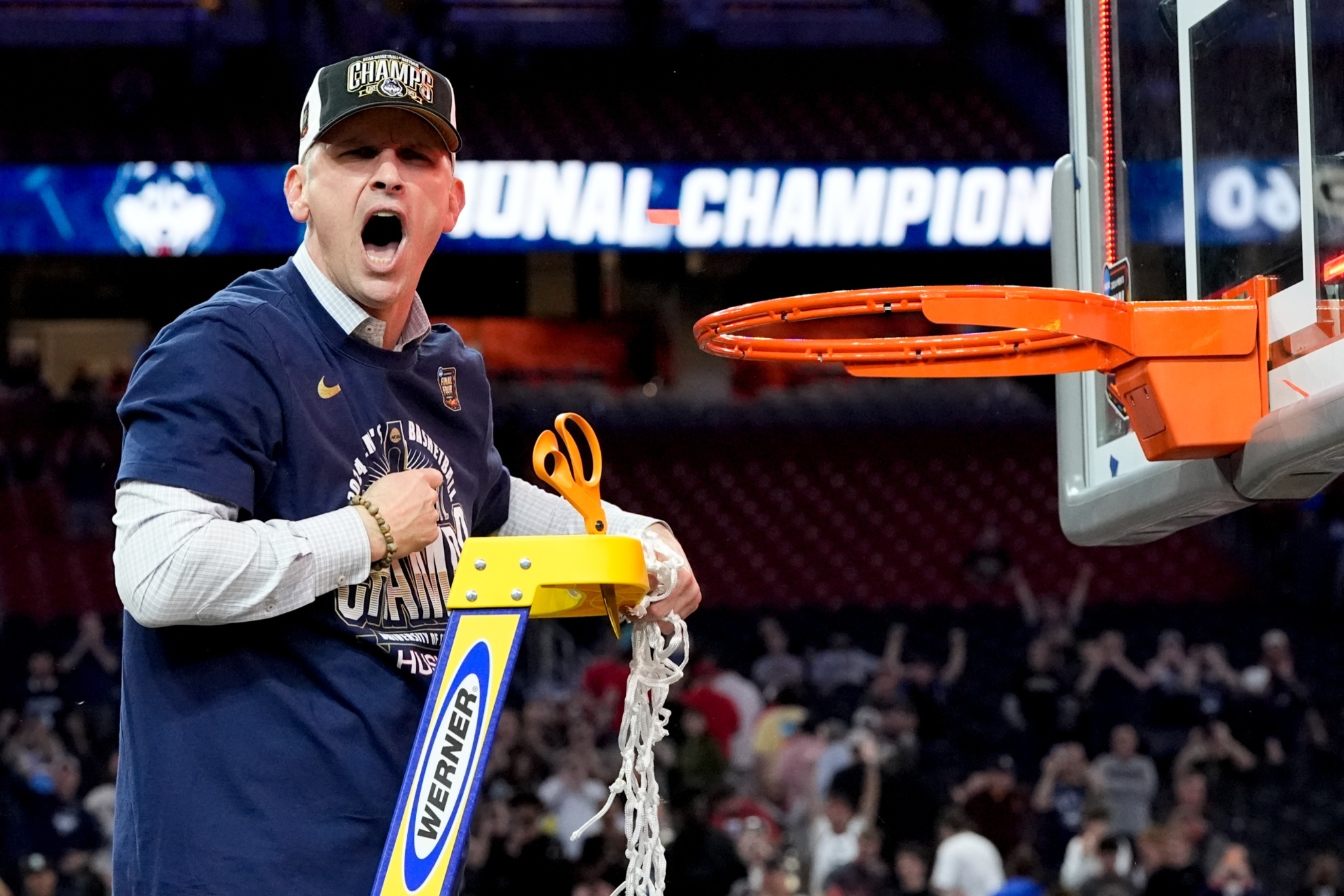 FILE - UConn head coach Dan Hurley celebrates cutting the net after their win against Purdue in the NCAA college Final Four championship basketball game, Monday, April 8, 2024, in Glendale, Ariz. UConn and mens basketball coach Dan Hurley have agreed to a six-year, $50 million contract through the 2029-30 season, nearly a month after he turned down a lucrative offer to coach the Los Angeles Lakers. (AP Photo/David J. Phillip, File)