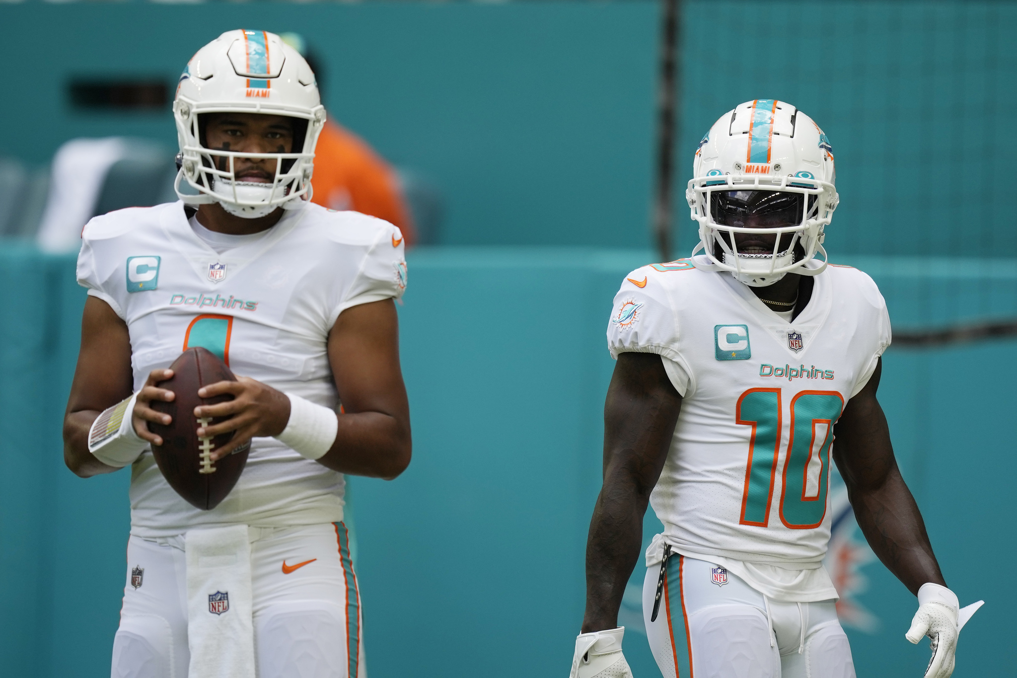 Miami Dolphins quarterback Tua Tagovailoa (1) and wide receiver Tyreek Hill (10)