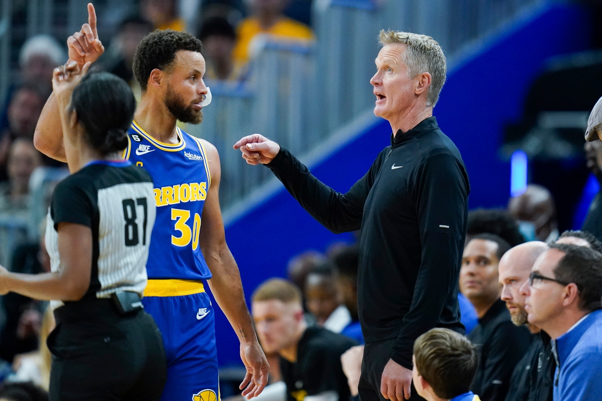 Stephen Curry and Steve Kerr at a Warriors game