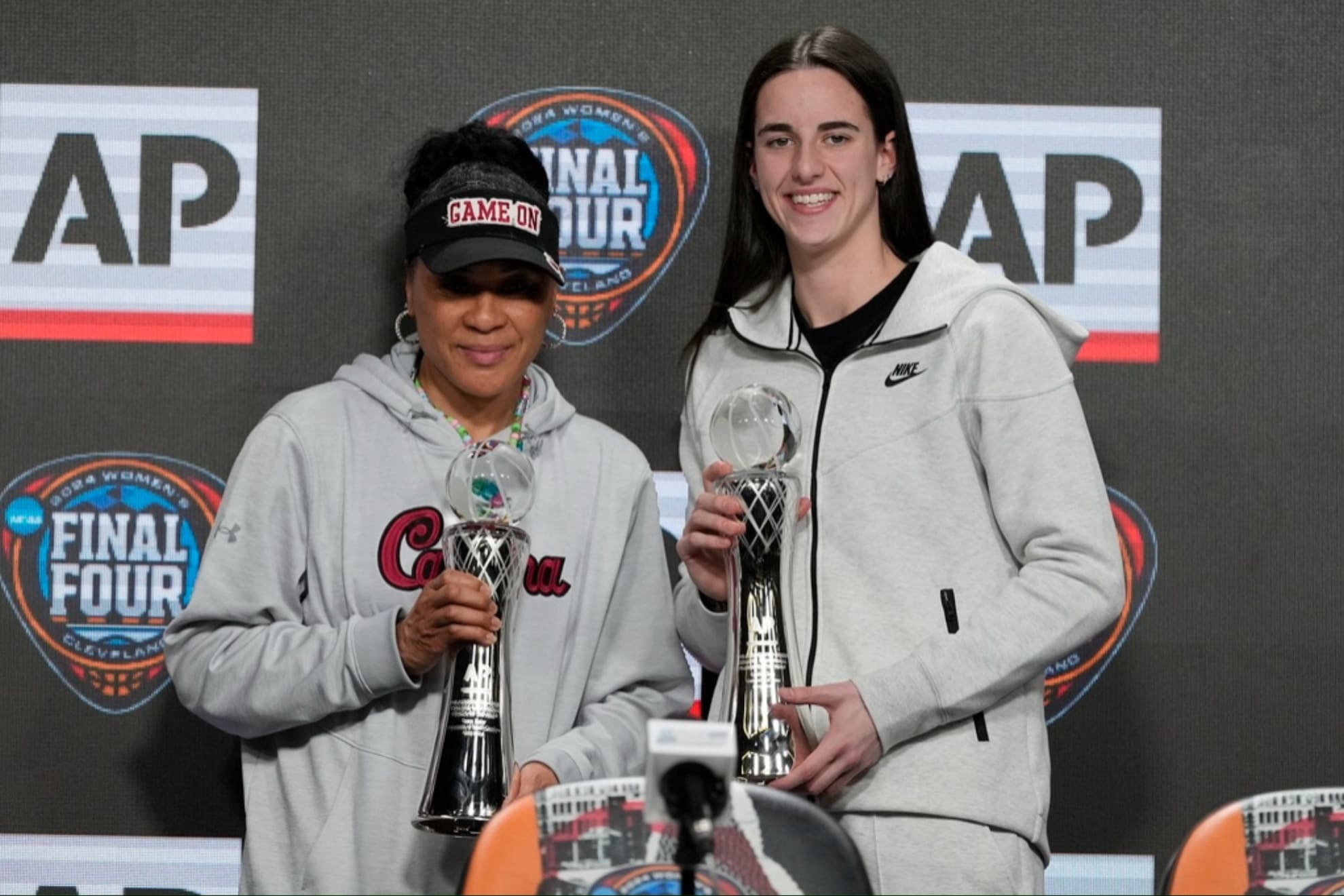 South Carolina head coach Dawn Staley and former Iowa star Caitlin Clark.