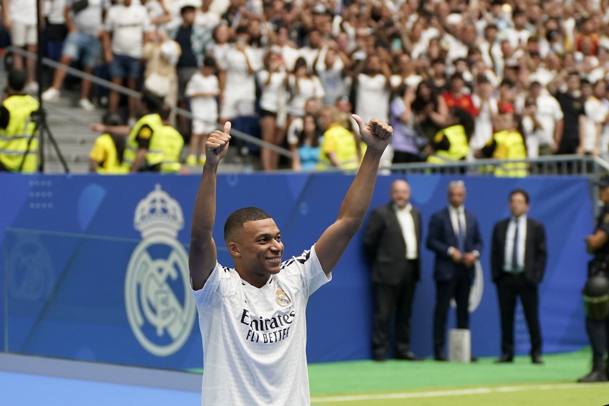 Kylian Mbappe, of France, gestures as he is presented to fans as a new Real Madrid player at the Santiago Bernabeu stadium