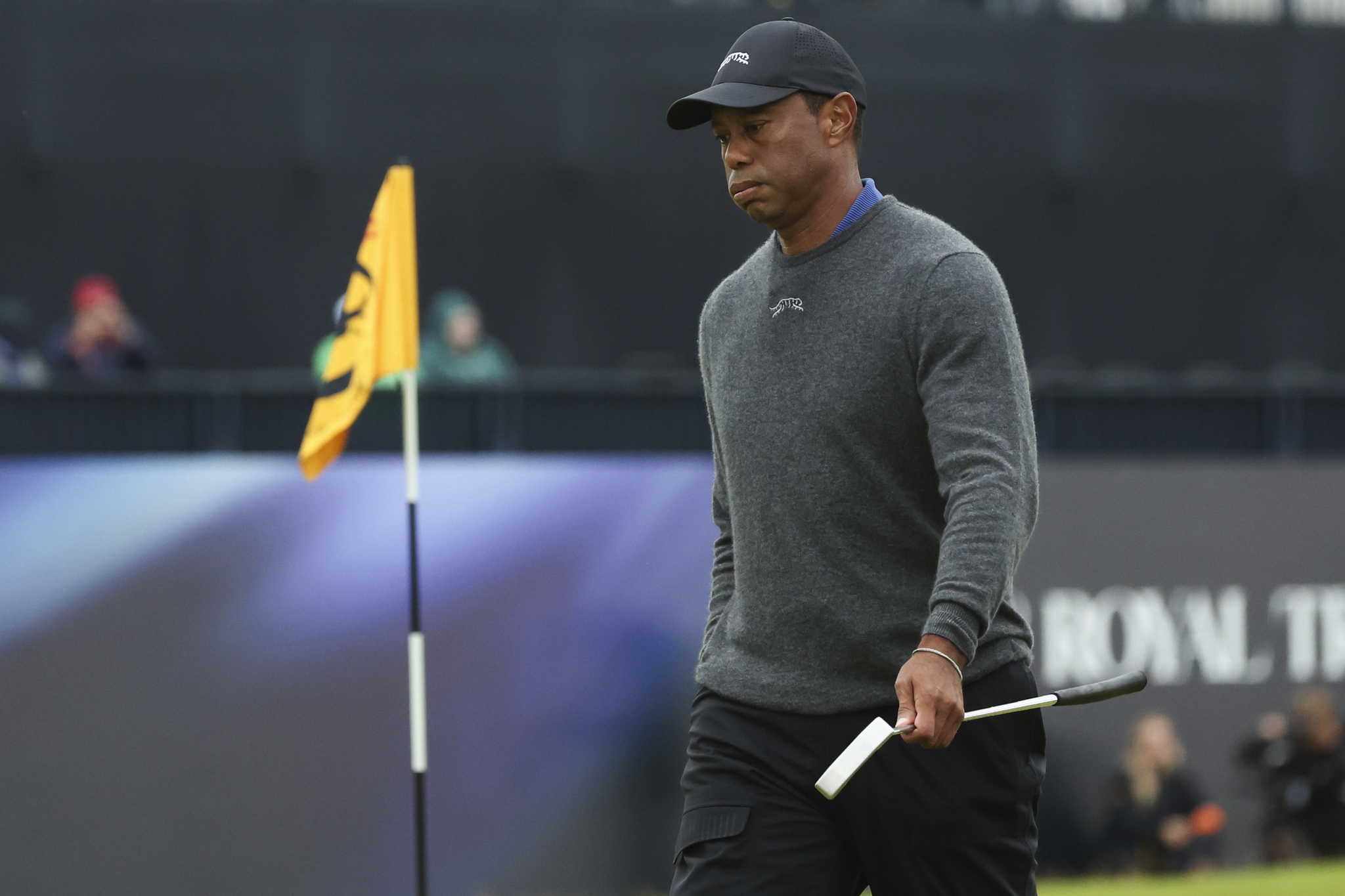 Tiger Woods walks from the 18th green following his opening round of the British Open Golf Championship