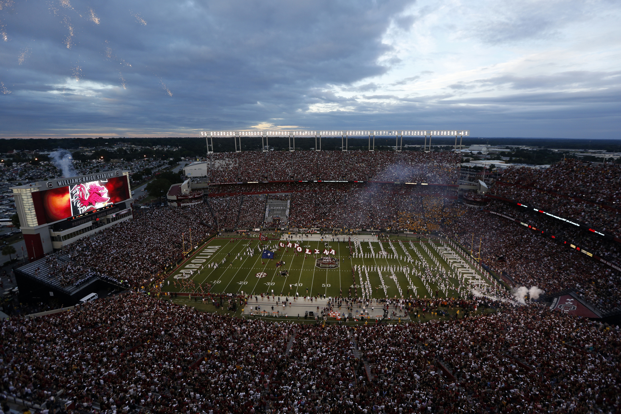 Fans cheer as South Carolina takes the field at William-Brice Stadium before the start of an NCAA college football game against Missouri, Sept. 27, 2014, in Columbia, S.C.