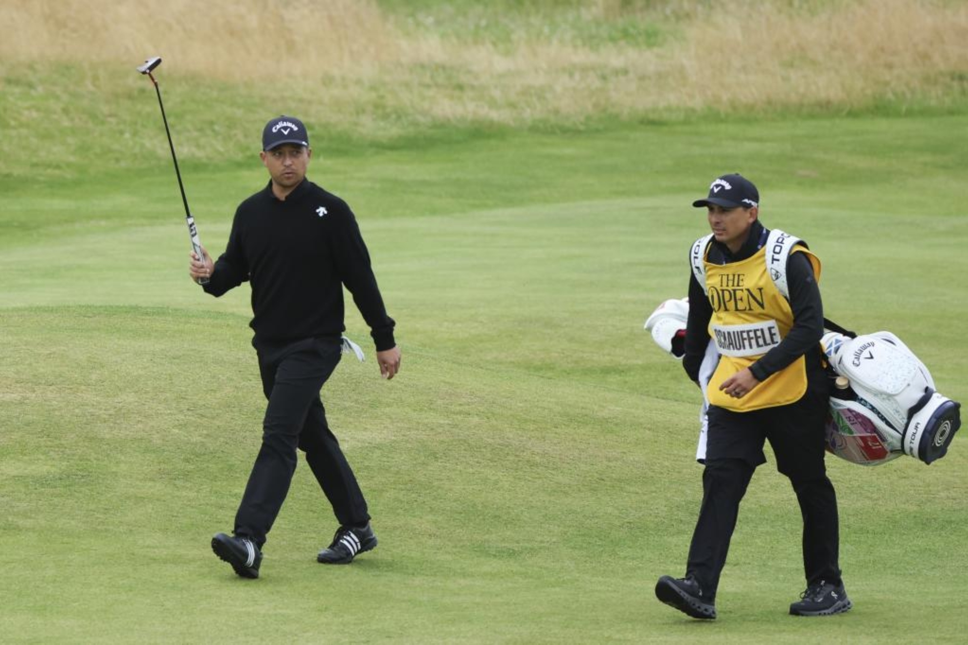 Xander Schauffele appreciates the applause on the 18th green.