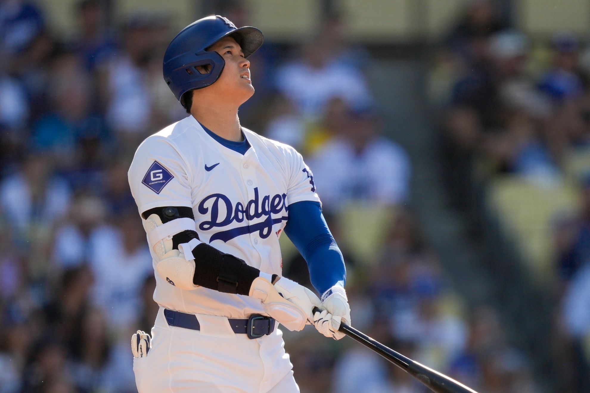 Los Angeles Dodgers designated hitter Shohei Ohtani watches his solo home run during the fifth inning of a baseball game against the Boston Red Sox, Sunday, July 21, 2024, in Los Angeles. (AP Photo/Ryan Sun)