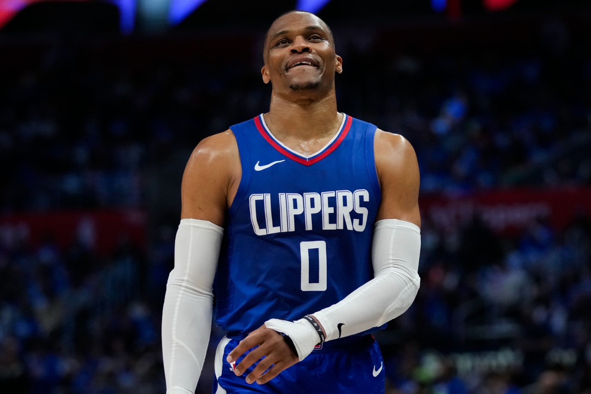 LA Clippers guard Russell Westbrook (0) walks down the court during a timeout during the second half of Game 1 of an NBA basketball first-round playoff series against the Dallas Mavericks in Los Angeles, Sunday, April 21, 2024. (AP Photo/Ashley Landis)