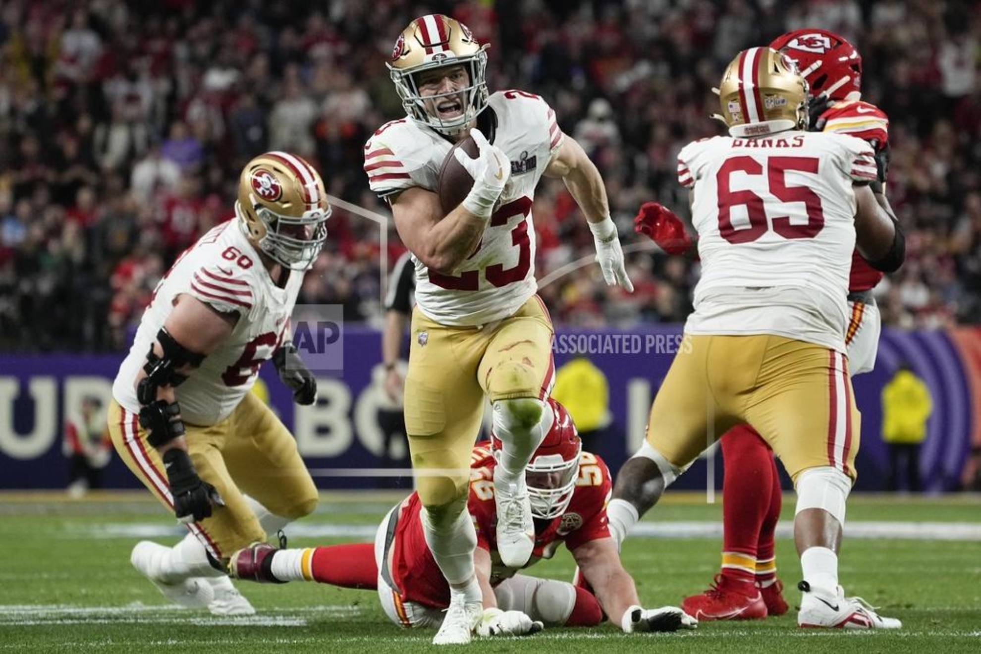 San Francisco 49ers running back Christian McCaffrey (23) runs into the end zone for a topuchdown against the Kansas City Chiefs during the first half of the NFL Super Bowl 58 football game Sunday, Feb. 11, 2024, in Las Vegas. (AP Photo/George Walker IV, File)