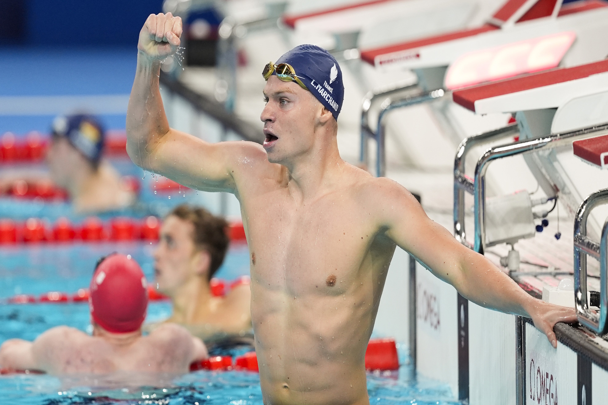 Leon Marchand, of France, celebrates after winning the mens 400-meter individual medley final at the 2024 Summer Olympics.