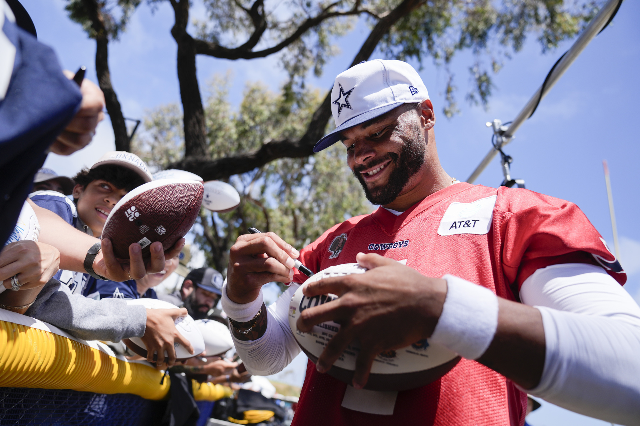 Dallas Cowboys quarterback Dak Prescott sign autographs during NFL football training camp on NFL Back Together Weekend