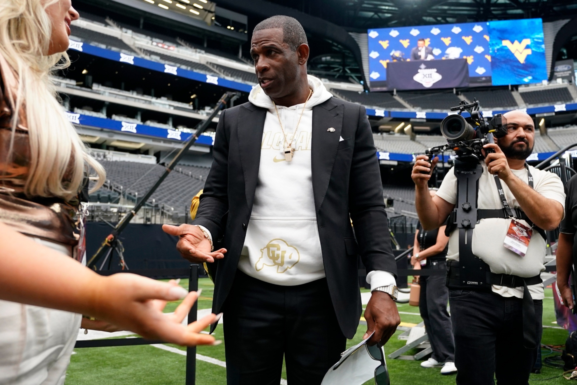 Colorado head coach Deion Sanders talks with media during Big 12 NCAA college football media days in Las Vegas, Wednesday, July 10, 2024. (AP Photo/Lucas Peltier)