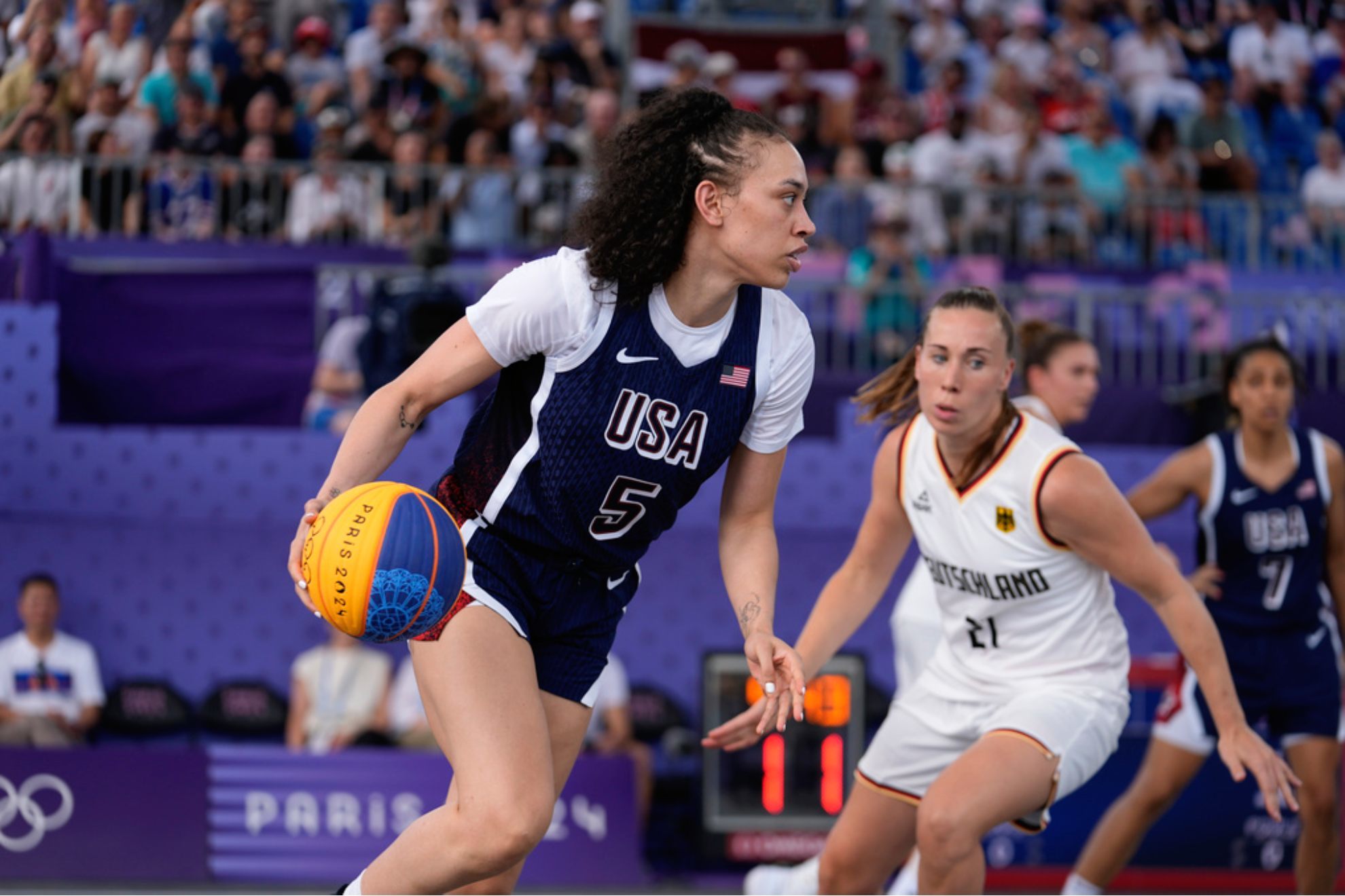 Dearica Hamby of the United States drives past Svenja Brunckhorst of Germany /