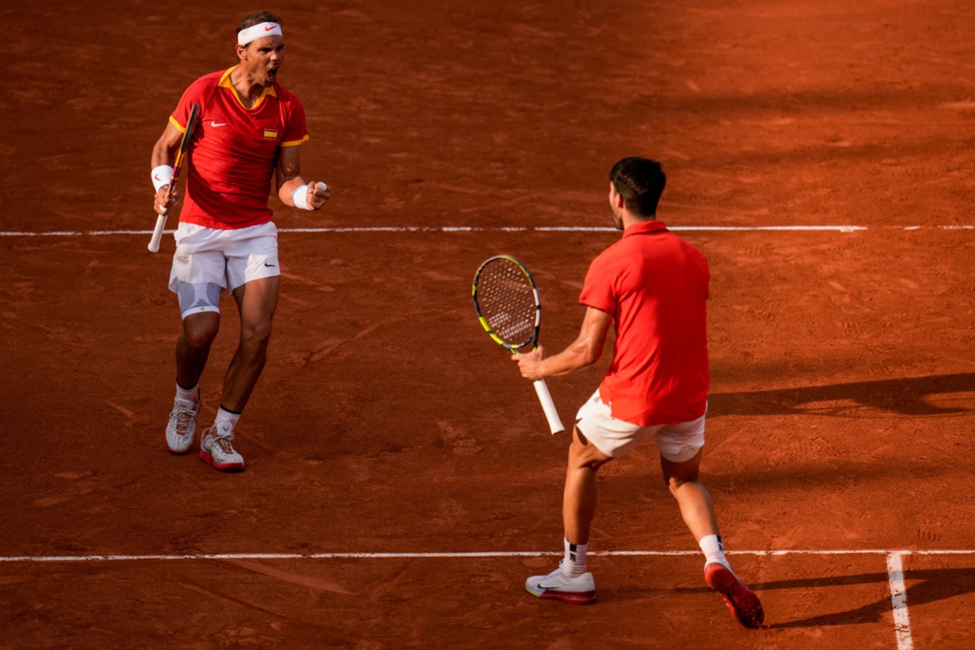 Carlos Alcaraz and Rafael Nadal celebrate a point against Tallon Griekspoor and Wesley Koolhof of the Netherlands