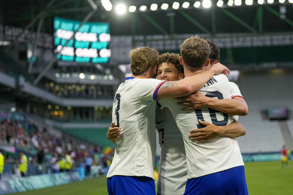 Kevin Paredes celebrates with his teammates during the game between the United States and Guinea at the 2024 Summer Olympics