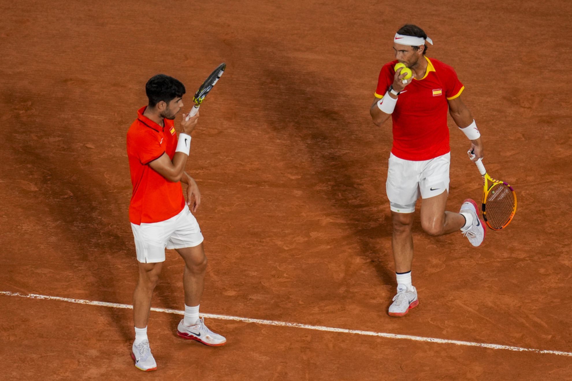 Carlos Alcaraz and Rafael Nadal of Spain compete against Austin Krajicek Rajeev Ram of the USA /