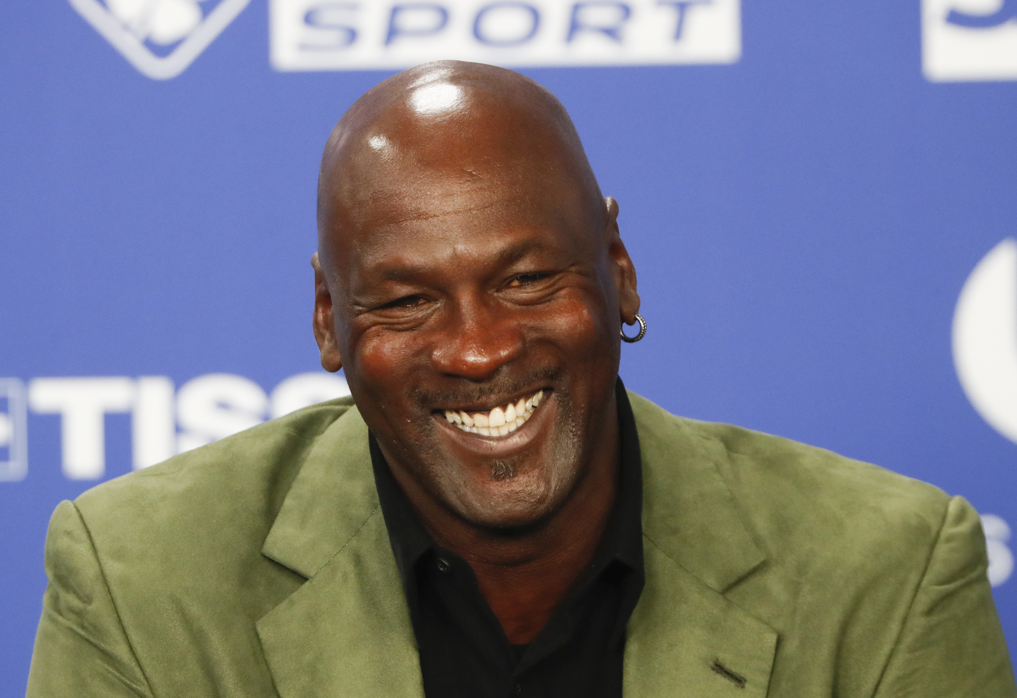 Michael Jordan steals the spotlight while smoking cigars and dancing to Caribbean beats