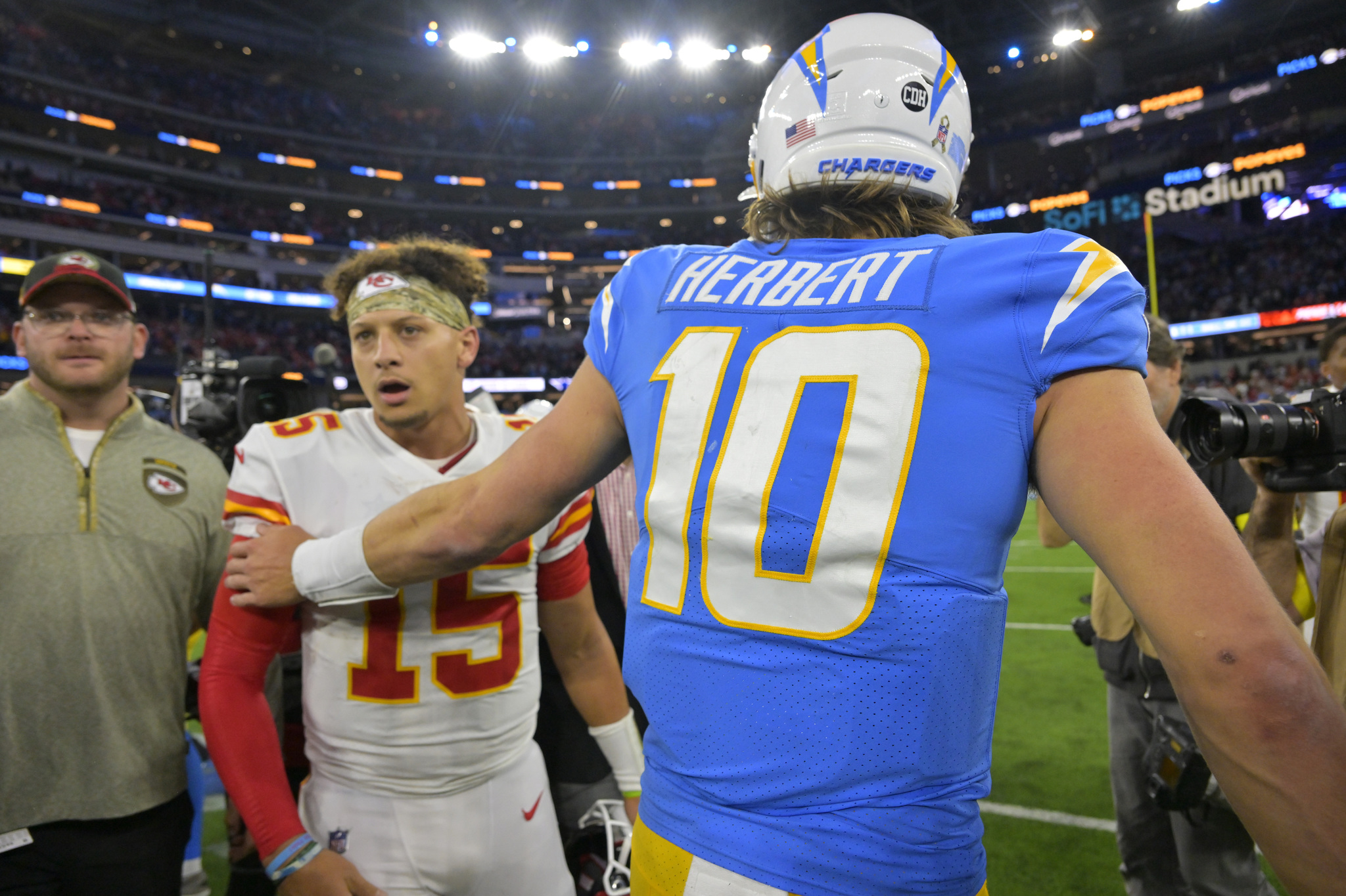 Kansas City Chiefs quarterback Patrick Mahomes, left, and Los Angeles Chargers quarterback Justin Herbert greet each