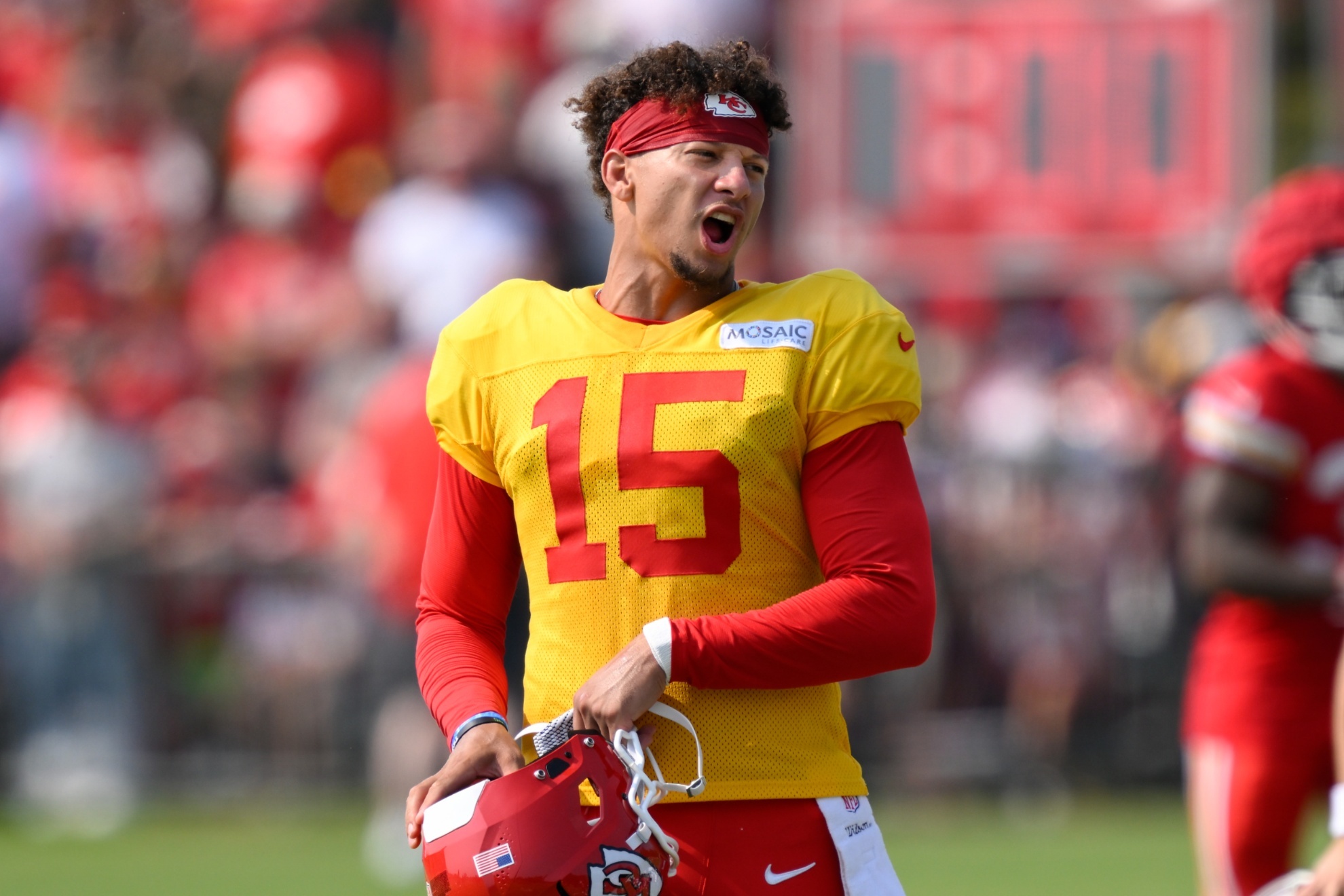 Kansas City Chiefs quarterback Patrick Mahomes yells to teammates after a drill during NFL football training camp Friday, July 26, 2024, in St. Joseph, Mo. (AP Photo/Reed Hoffmann)