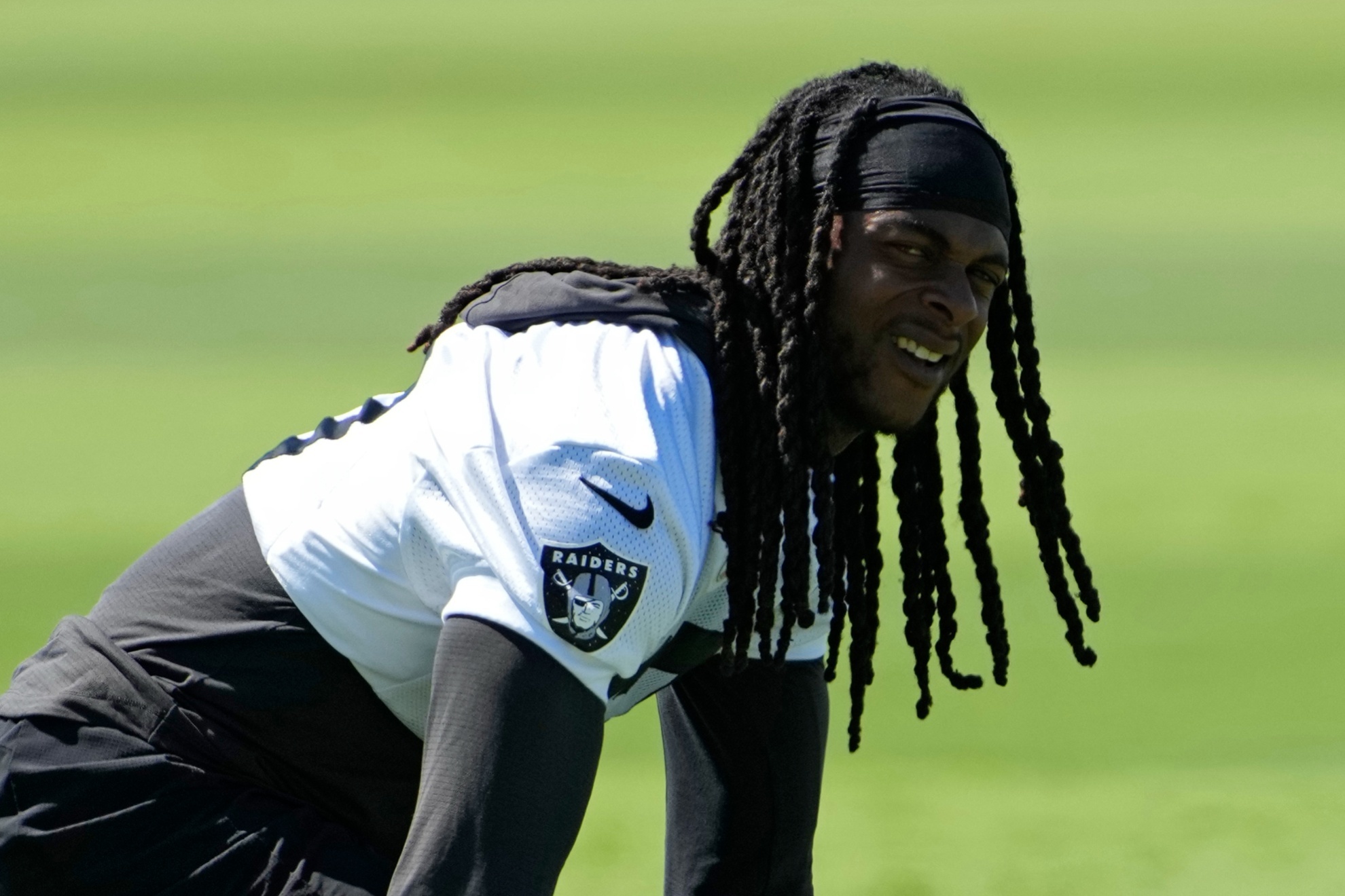 Las Vegas Raiders wide receiver Davante Adams (17) warms up during an NFL football practice Wednesday, June 12, 2024, in Henderson, Nev. (AP Photo/John Locher)