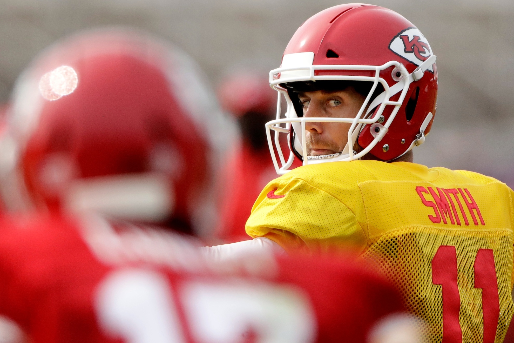 Kansas City Chiefs quarterback Alex Smith (11) looks for a receiver during NFL football training camp Monday, Aug. 7, 2017, in St. Joseph, Mo. (AP Photo/Charlie Riedel)