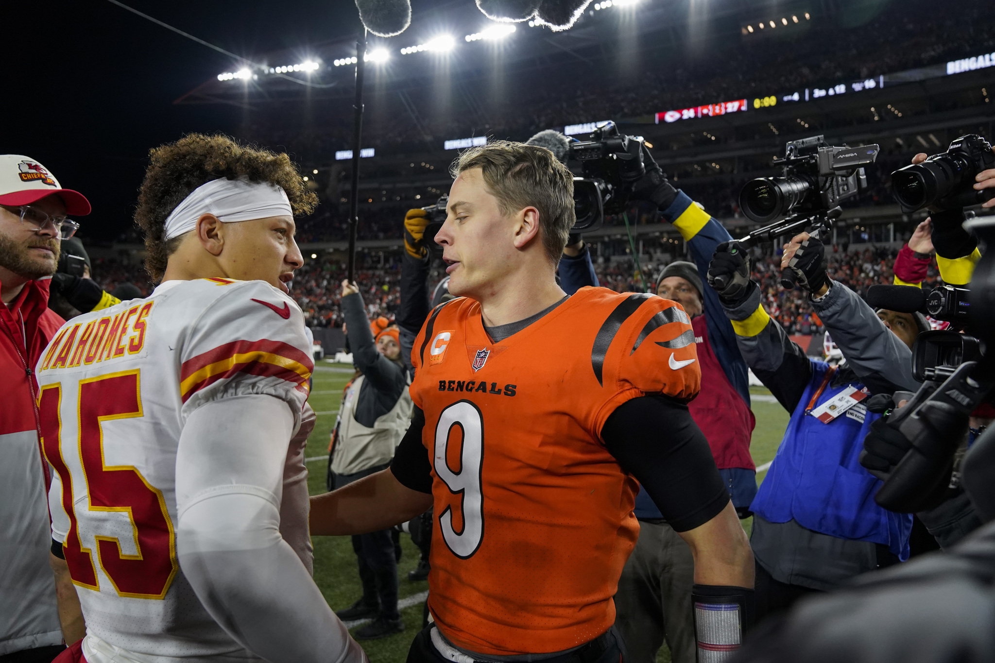 Cincinnati Bengals quarterback Joe Burrow (9) speaks with Kansas City Chiefs quarterback Patrick Mahomes (15) following an NFL football game