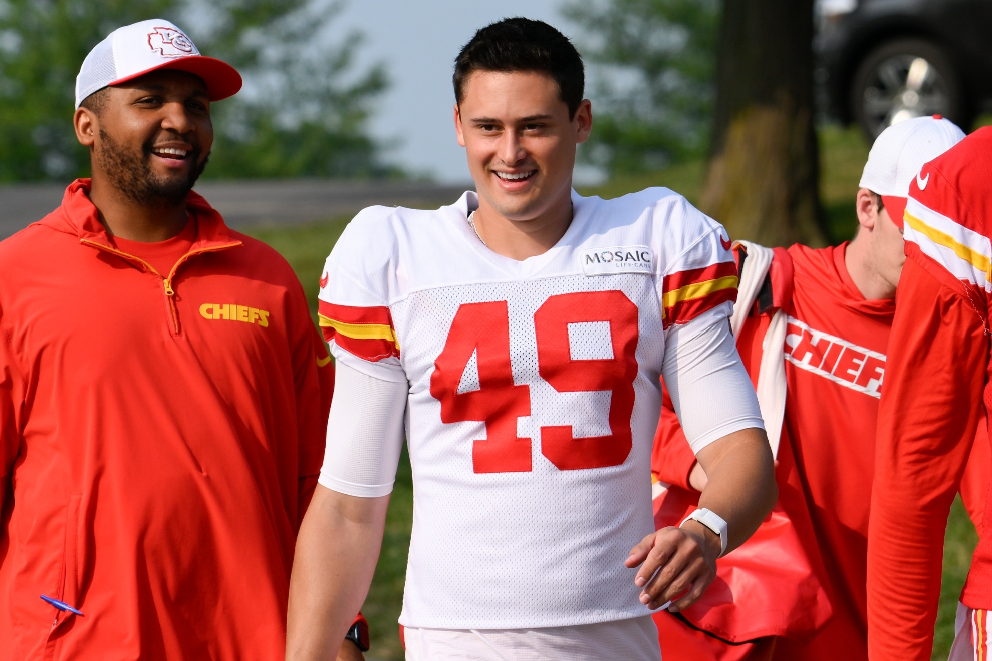 Kansas City Chiefs punter Matt Araiza (49) walks to the field at the start of an NFL football training camp Saturday, July 27, 2024, in St. Joseph, Mo. (AP Photo/Reed Hoffmann)