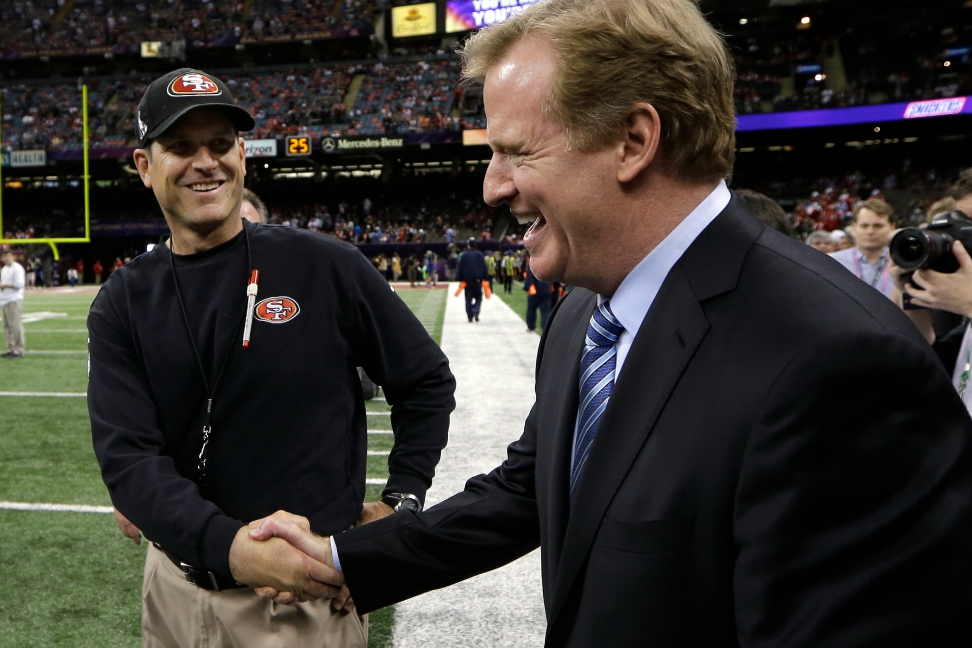 San Francisco 49ers head coach Jim Harbaugh, left, greets NFL Commissioner Roger Goodell before the NFL Super Bowl XLVII football game against the Baltimore Ravens, Sunday, Feb. 3, 2013, in New Orleans. (AP Photo/Matt Slocum)