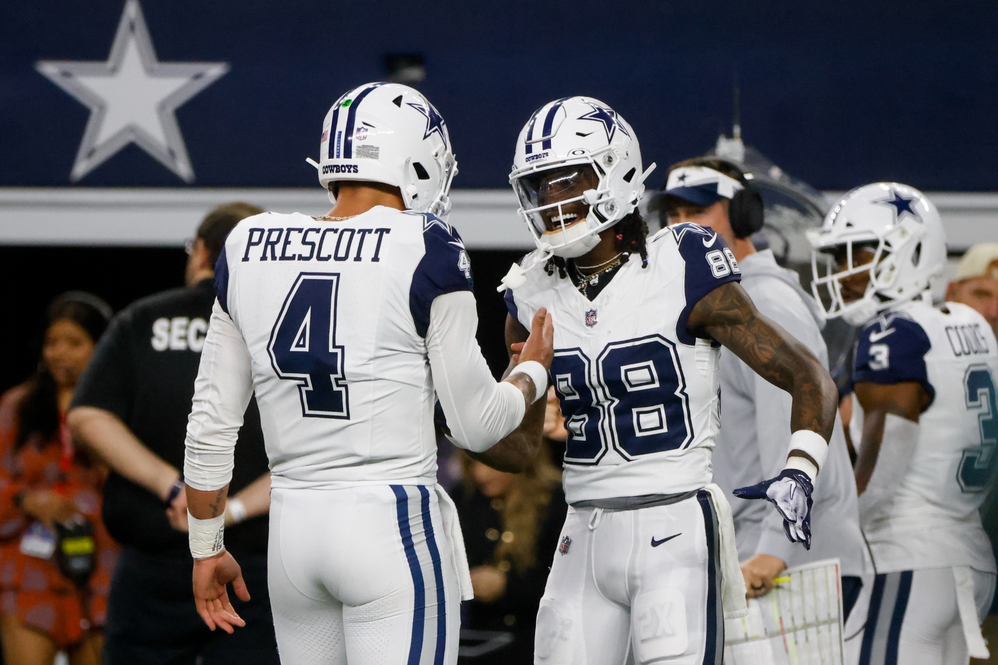 Dallas Cowboys quarterback Dak Prescott (4) and wide receiver CeeDee Lamb (88) react after connecting for a touchdown against the Philadelphia Eagles during the first half of an NFL football game, Sunday, Dec. 10, 2023, in Arlington, Texas. (AP Photo/Michael Ainsworth)