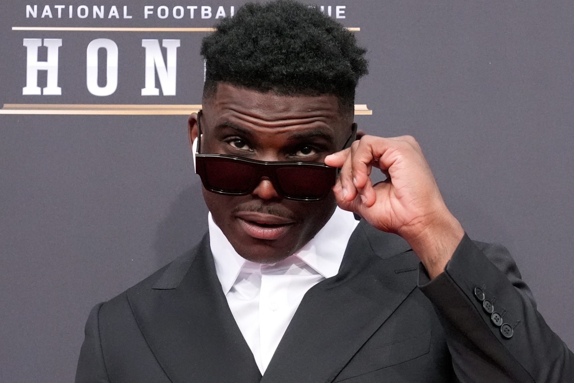 Tyreek Hill of the Miami Dolphins poses on the red carpet at the NFL Honors award show ahead of the Super Bowl 58 football game Thursday, Feb. 8, 2024, in Las Vegas. The San Francisco 49ers face the Kansas City Chiefs in Super Bowl 58 on Sunday. (AP Photo/Charlie Riedel)