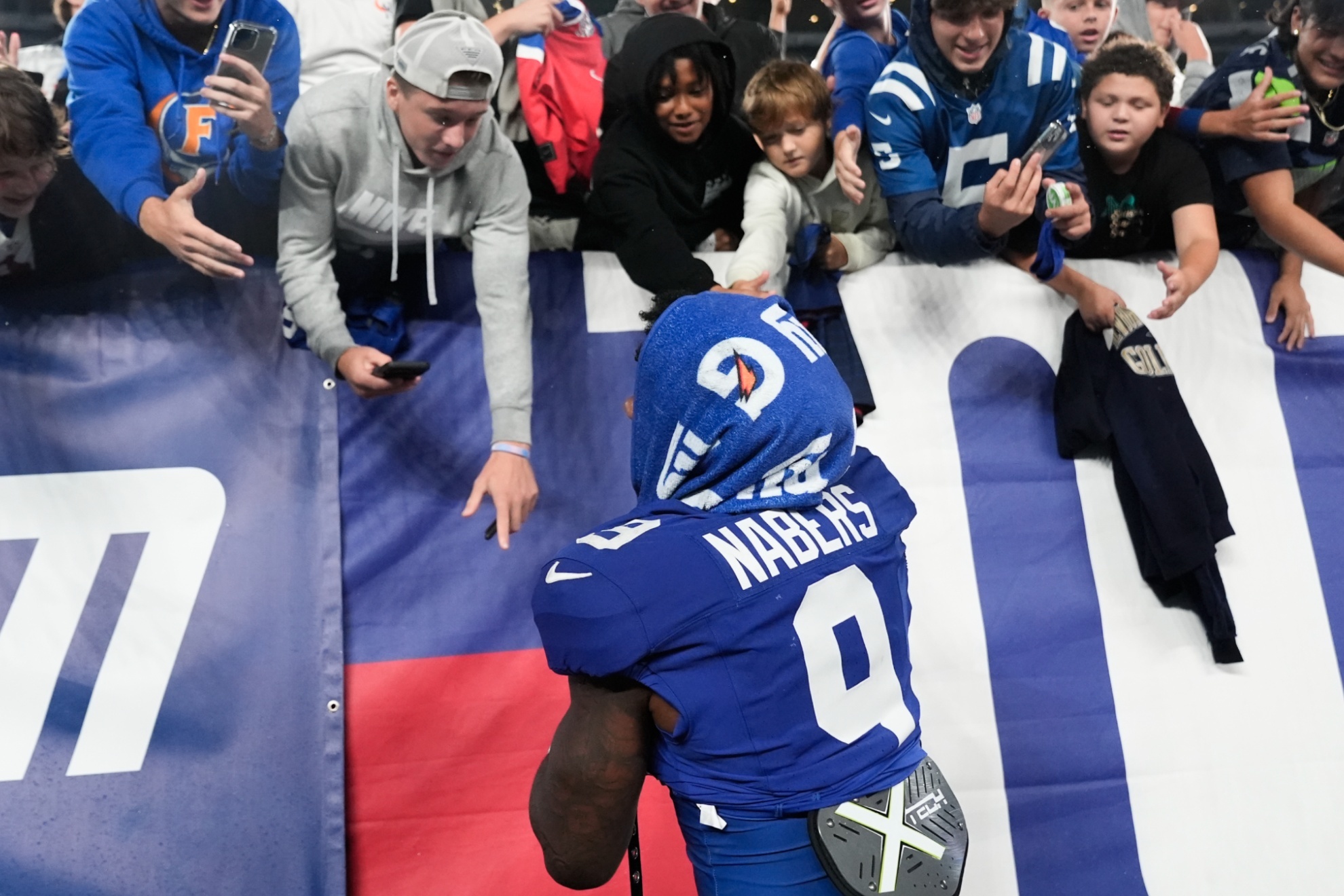 New York Giants wide receiver Malik Nabers (9) greets fans after playing against the Detroit Lions in an NFL football game, Thursday, Aug. 8, 2024, in East Rutherford, N.J. (AP Photo/Pamela Smith)