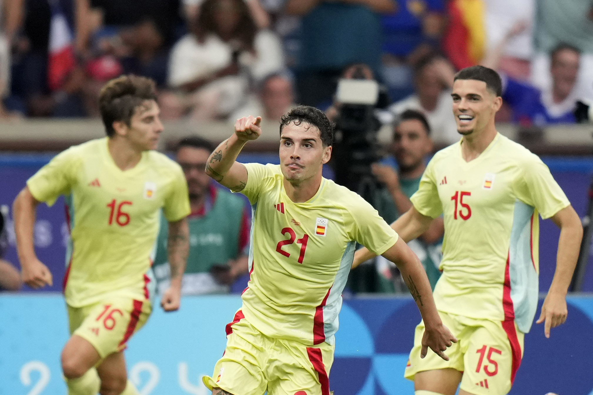 Sergio Camello, centre, celebrates after scoring his teams fourth goal