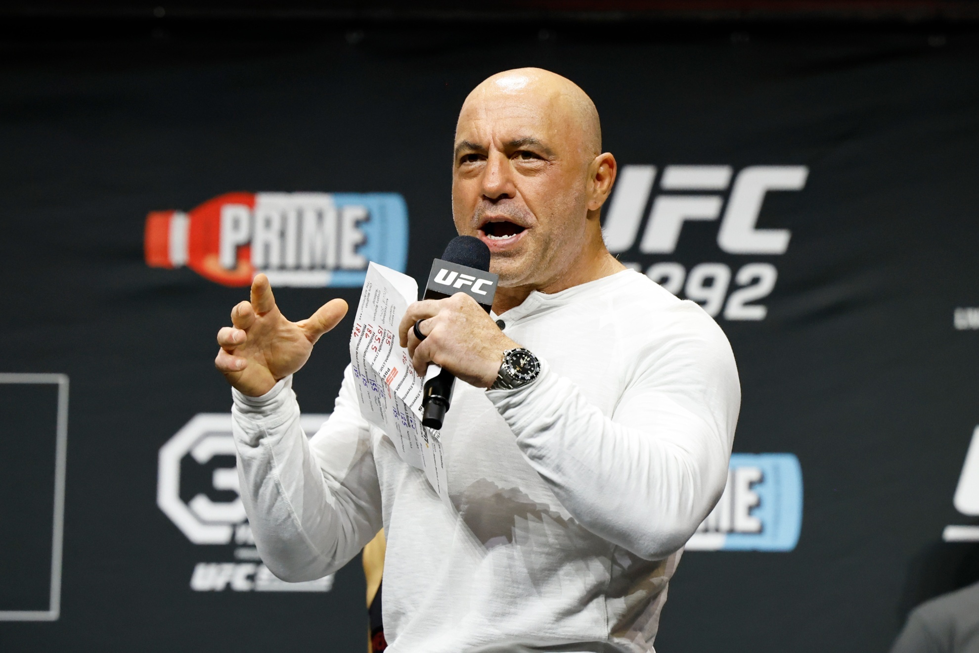 Joe Rogan is seen at the ceremonial weigh-in for the UFC 292 mixed martial arts event, Friday, August 18, 2023, in Boston. (AP Photo/Gregory Payan)