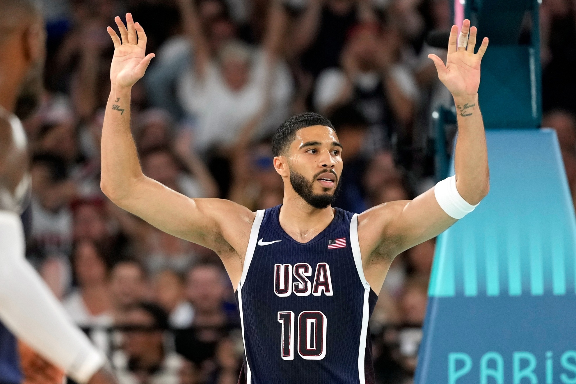 United States Jayson Tatum, right, celebrates after dunking as United States LeBron James watches during a mens basketball game against Brazil at the 2024 Summer Olympics, Tuesday, Aug. 6, 2024, in Paris, France. (AP Photo/Michael Conroy)