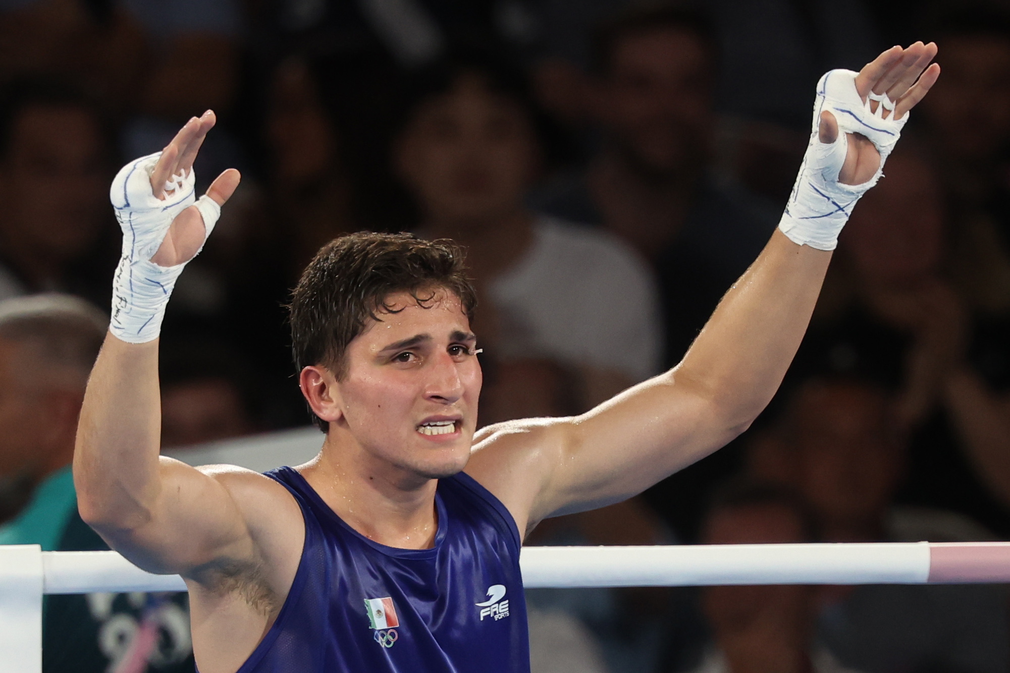 Marco Alonso celebrates winning against Lewis Richardson in the Mens 71kg semifinal