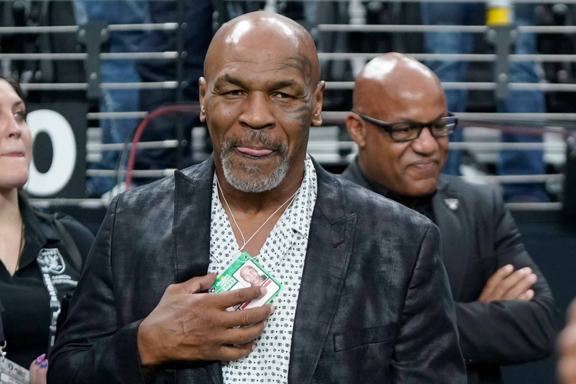 FILE - Former heavyweight boxing champion Mike Tyson stands on the field before an NFL football game between the Las Vegas Raiders and the Pittsburgh Steelers Sunday, Sept. 24, 2023, in Las Vegas. Tysons fight against Jake Paul in Texas this summer has been sanctioned as a competitive boxing match rather than an exhibition, and the rounds will be shorter and the gloves will be heavier. The Texas Department of Licensing and Regulation this week approved terms for the July 20 fight at AT&T Stadium in Arlington. (AP Photo/Mark J. Terrill, File)