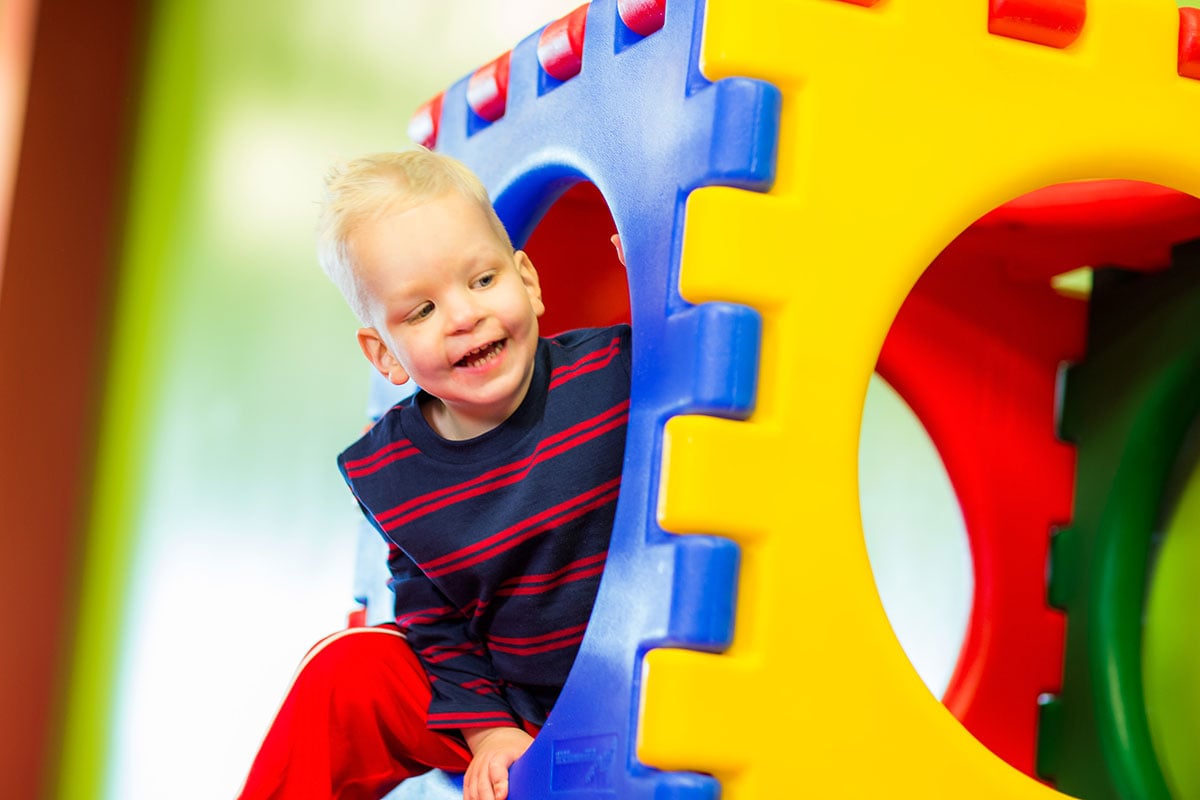 Boy playing in play structure