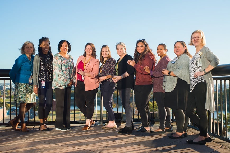 A group of Advanced Practice Providers stand outside for a photo.