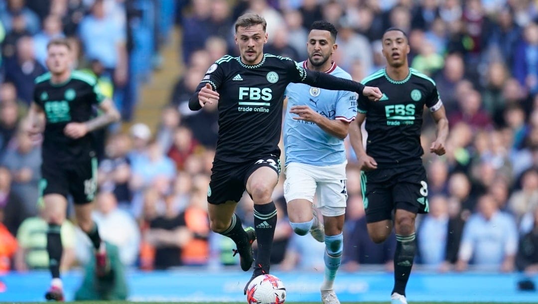 Leicester's Kiernan Dewsbury-Hall, centre, in action during the English Premier League soccer match between Manchester City and Leicester City at Etihad Stadium in Manchester, England, Saturday, April 15, 2023. (AP Photo/Dave Thompson)