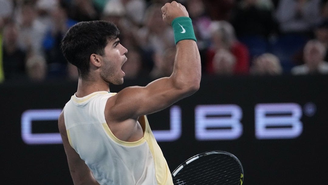 Carlos Alcaraz of Spain reacts during his quarterfinal match against Alexander Zverev of Germany at the Australian Open tennis championships at Melbourne Park, Melbourne, Australia, Wednesday, Jan. 24, 2024.